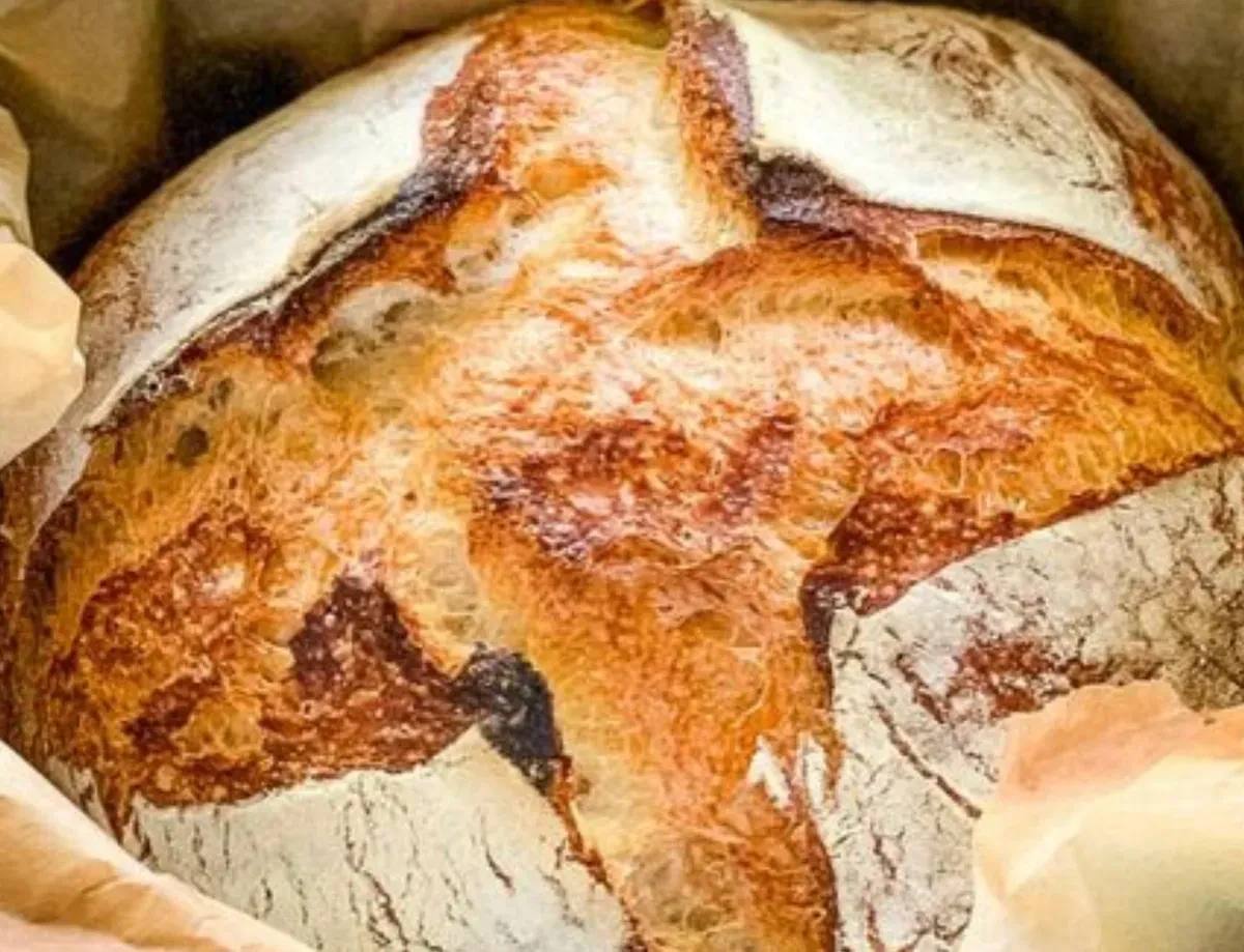 Close-up of a rustic, crusty loaf of artisan bread.